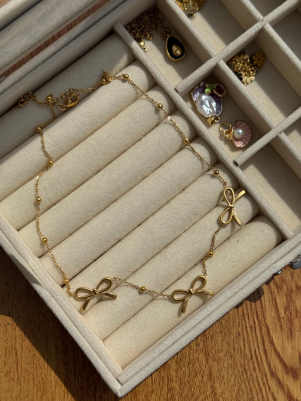 Triple-bow pendant