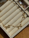 Triple-bow pendant